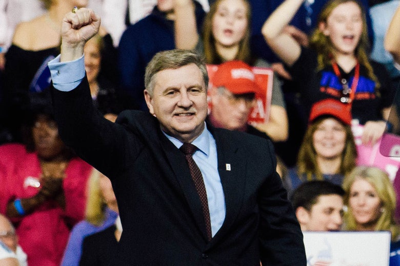 Rick Saccone pumps his fist in the air.